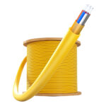 0.9mm GJFJV Tight Buffer Fiber Optic Cable coiled into a round bundle on a wooden spool.