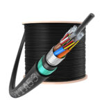 GYTA53 Direct Bury Fiber Optic Cable coiled into a round bundle on a wooden spool.