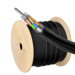 GYTZA Armored Fiber Optic Cable, Stranded Loose Tube coiled into a round bundle on a wooden spool.